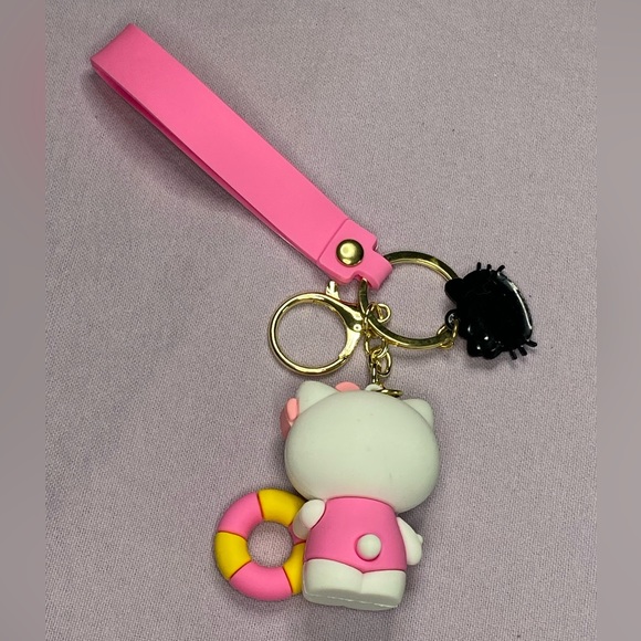 ‼️CLEARANCE‼️ 🩷🐱 Hello Kitty Summer Fun 3D Keychain and Silicone Wristlet - Picture 2 of 3